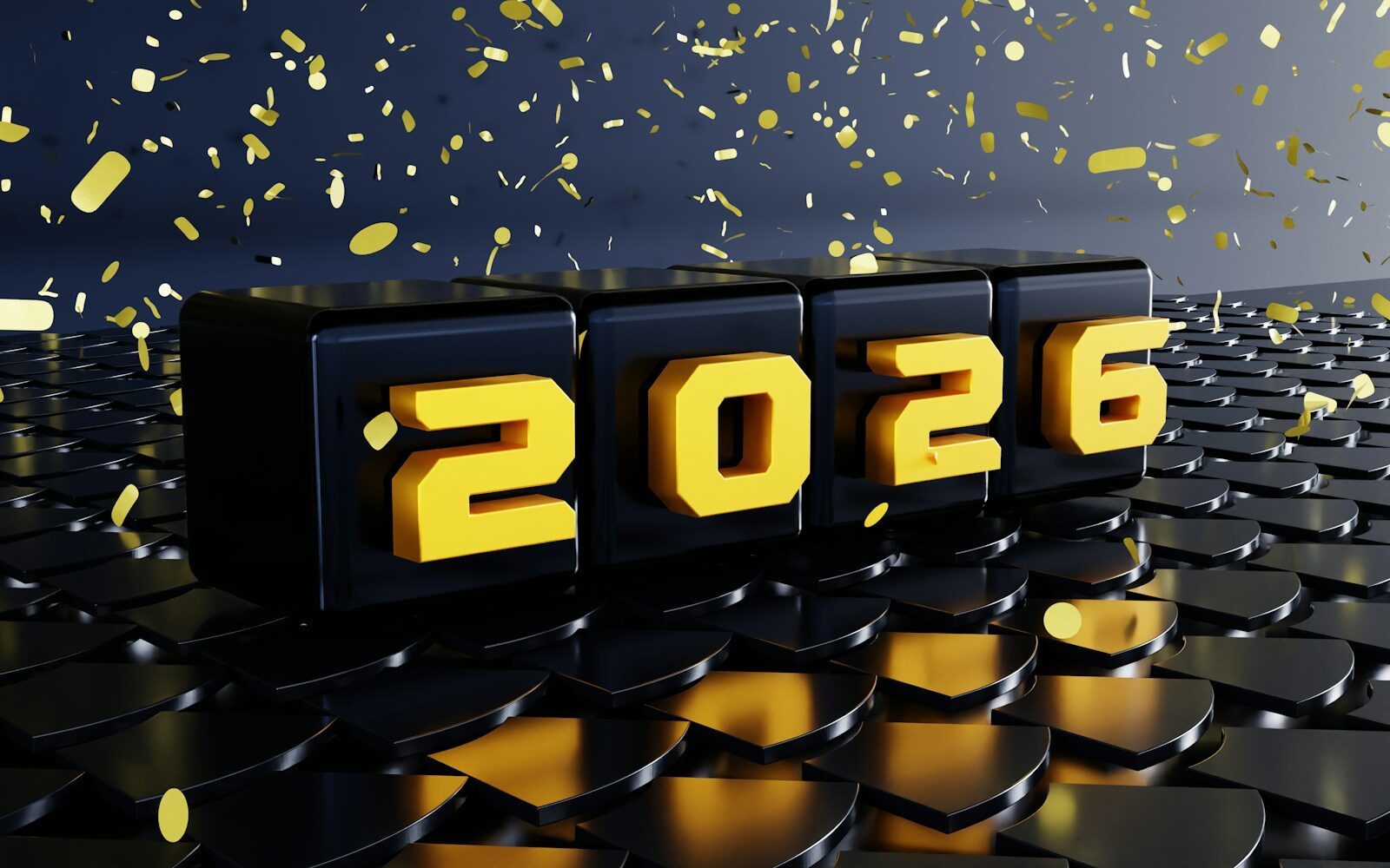 Black blocks with yellow numbers 2026 and confetti